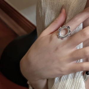 Minimalist S925 sterling silver plumeria open ring with hollowed floral design on finger