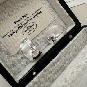 Minimalist S925 sterling silver oval hoop earrings with matte finish in jewelry box