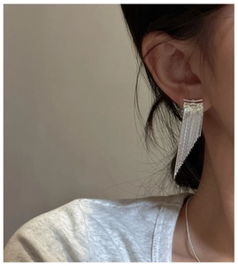 Close-up of S925 sterling silver tassel earrings featuring a delicate multi-chain design