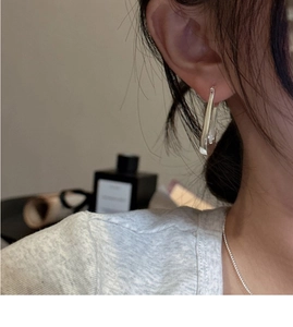 Minimalist S925 sterling silver rectangular hoop earrings shown on a model close-up