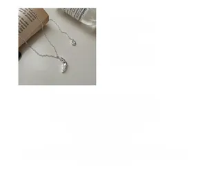 Detailed view of S925 sterling silver croissant necklace with 66cm adjustable chain length
