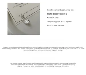 Detail view of water drop silver ear cuff showing 22.8mm size and polished finish