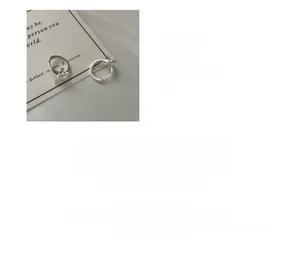 Macro shot of S925 sterling silver bow-knot hoop earrings with plated finish detail