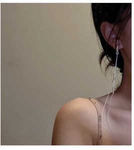 Close-up of S925 sterling silver long tassel earrings featuring delicate metal beads