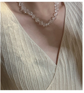 Close-up of S925 sterling silver clavicle chain with textured white crystal beads