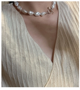 Macro shot of S925 silver necklace with baroque shell pearls and OT toggle clasp
