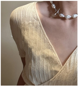 Detailed close-up of S925 silver necklace with baroque shell pearl and OT toggle clasp