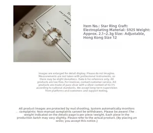Detail of S925 sterling silver beaded elastic rings with polished star charms