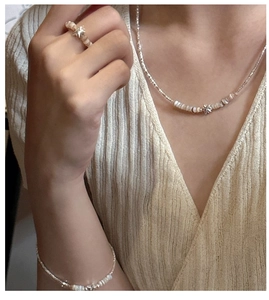 Close-up of S925 sterling silver jewelry set with star pendants and delicate white pearls
