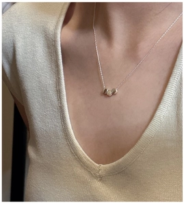 Close-up of S925 sterling silver minimalist triple bead pendant on a classic chain necklace