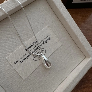 Elegant S925 sterling silver waterdrop necklace with snake chain on a jewelry tray