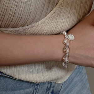 Minimalist S925 silver beaded bracelet featuring clear teardrop crystals and round coin charm