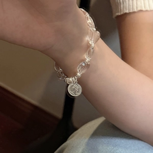 S925 sterling silver beaded bracelet with clear crystal hearts and a vintage coin pendant