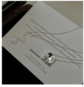 Macro detail of S925 silver irregular square pendant necklace with lobster clasp closure