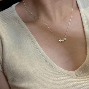 Minimalist S925 silver necklace featuring three smooth rose gold beads on a fine chain