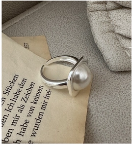 Macro shot of S925 sterling silver ring with large white mabe pearl in square setting