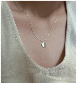 Minimalist S925 sterling silver round pendant necklace on a model's neck in gold finish