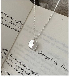 Detail view of S925 sterling silver necklace with matte and polished circular pendant