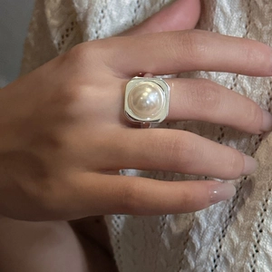 Minimalist S925 sterling silver ring with a large square base and Mabe pearl on finger
