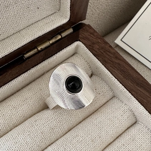 S925 silver ring featuring concentric ripple textures and a round black agate stone inlay