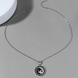 Vintage stainless steel necklace featuring a wolf head yin-yang pendant with runic engraving