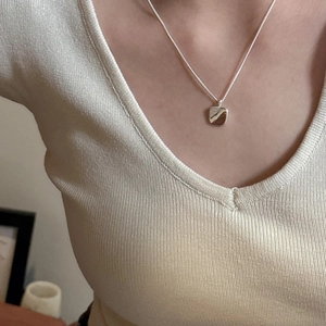 Minimalist S925 sterling silver square pendant necklace shown on a model neck