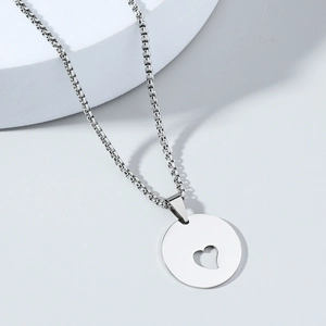 Polished silver stainless steel necklace with a round cutout heart pendant for women
