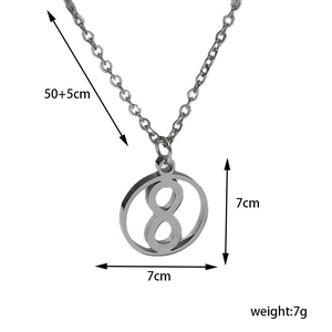 Detail view of round figure 8 pendant on O-chain with specific length and weight markings