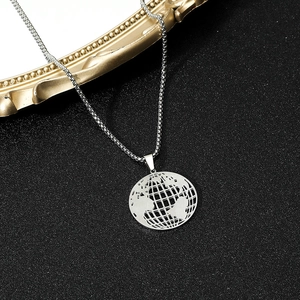 Detailed view of hollow world map globe pendant on a stainless steel box chain