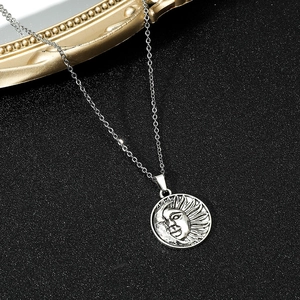 Silver sun and moon face pendant on stainless steel chain with vintage texture