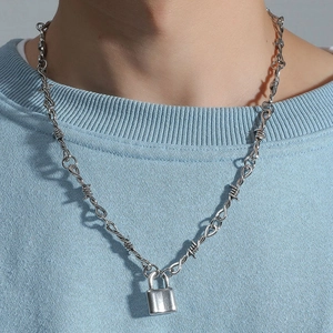 Hip hop silver lock pendant necklace with thorn wire chain on light blue sweater
