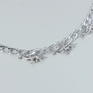 Silver Cuban link necklace featuring multiple dinosaur pendants for men and women