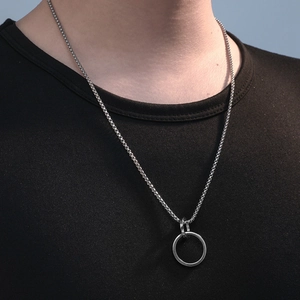 Minimalist silver double ring pendant stainless steel necklace on black shirt background