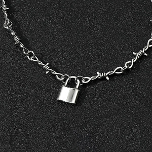 Macro view of hip hop silver lock pendant with thorns style alloy chain link