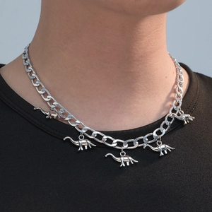 Silver dinosaur pendant necklace with Cuban chain for men, stylish dinosaur jewelry piece