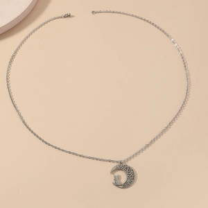 Minimalist stainless steel necklace featuring hollow moon pendant with cat silhouette