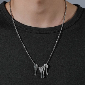 Men's silver ball chain necklace featuring minimalist four-key pendant set in industrial style