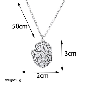 Macro shot of silver anatomical heart pendant with 50cm O-chain and size specifications
