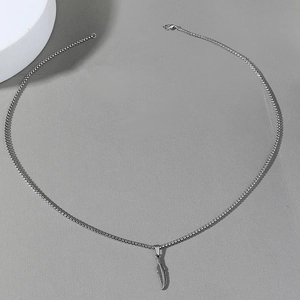 Polished stainless steel feather pendant necklace with vintage box chain on grey background