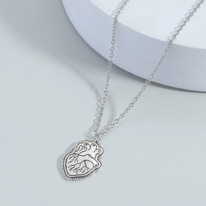 Vintage silver anatomical heart pendant necklace with realistic details and link chain