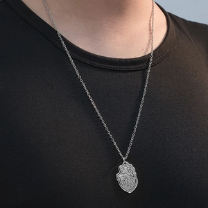 Men's vintage anatomical heart pendant necklace with silver O-chain on model