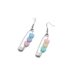 Pastel macaron heart charms on silver safety pin earrings with a minimalist design