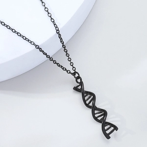 Macro shot of black DNA double helix pendant on a matching cross chain with high gloss finish
