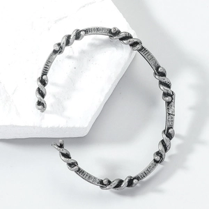 Retro oxidized silver braided bangle featuring twisted rope and hand-carved metal textures