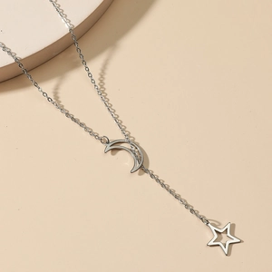 Silver Y-necklace with elegant crescent moon and star pendants for women in minimalist style