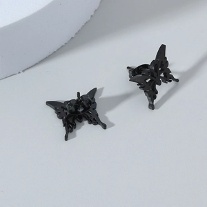 Black hollow butterfly stud earrings in stainless steel with a gothic minimalist design