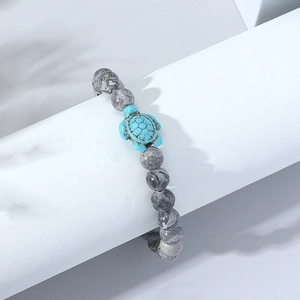 Elastic beaded bracelet featuring grey marble stone beads and a turquoise turtle charm