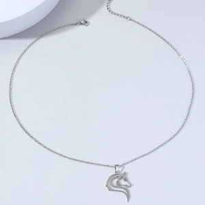 Stainless steel wolf head necklace with Celtic amulet pendant on light blue background