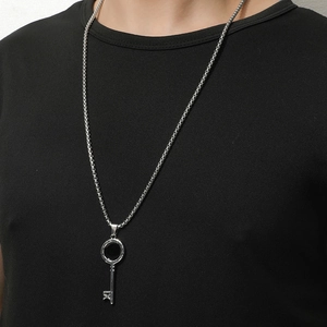 Men's titanium steel Roman numeral key pendant necklace with long box chain on black shirt