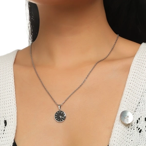 Minimalist silver clock pendant necklace with black dial on a delicate silver chain